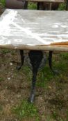 An old cast aluminium triple legged table - top a/f