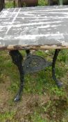 An old cast aluminium triple legged table - top a/f