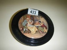 A rare framed Pratt ware pot lid.