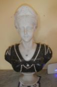 A large heavy marble bust of a lady.