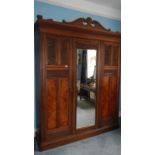 A large walnut combination wardrobe