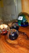 4 glass paperweights including Caithness and medicine bottles etc.