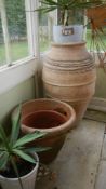 A large terracotta urn,