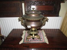 A Victorian copper samovar.