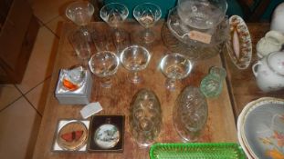 A large quantity of glass ware including jelly moulds, paperweights, cake stands etc.