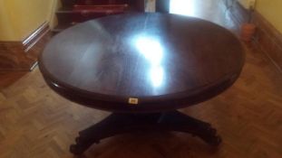 A Victorian rosewood tip up table