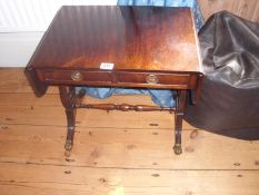 A small sofa table with Lyre sides