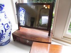 A Victorian mahogany toilet mirror with drawer base.