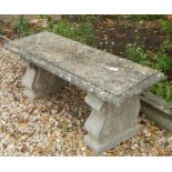 A stone garden bench