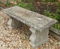 A stone garden bench