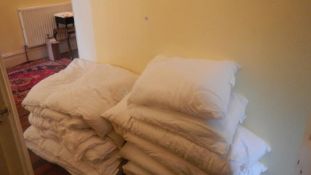 A large quantity of feather & down duvets and pillows, mainly doubles.