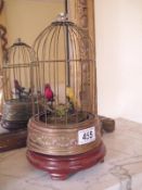 A miniature musical caged birds automaton, in need of repair,