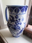 A large blue and white pottery jug.