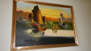 A contemporary oil on board Chinese Junks at Sea in gilt frame 98cm x 70cm (image 89cm x 60cm)