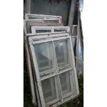 A quantity of sash windows some with fittings