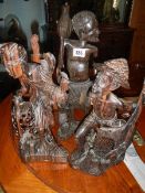 3 carved African figures,