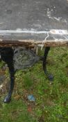 An old cast aluminium triple legged table - top a/f