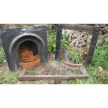 An old Victorian cast iron bedroom fireplace and a fire surround