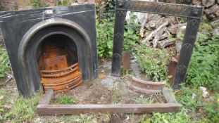 An old Victorian cast iron bedroom fireplace and a fire surround