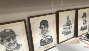 4 framed and glazed black and white prints of Formula 1 world champion racing drivers.