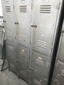 A vintage 6 door metal locker cabinet.