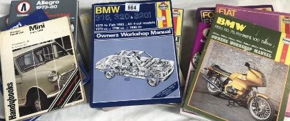 A box of car and motorcycle workshop manuels.