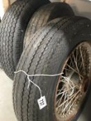 3 16" x 5" wire wheels, 2 tyres of unknown origin.