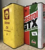 A Castrol oil can and a Shell oil can.