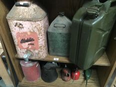 A quantity of vintage oil jugs, cans etc.