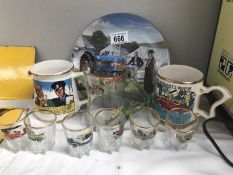 A quantity of motoring related glass and pottery items.