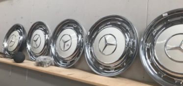 8 Mercedes W123 wheels trims and clips, 4 look new/unused.