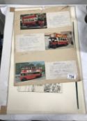 A folder containing prints of coaches and early steam vehicles etc.