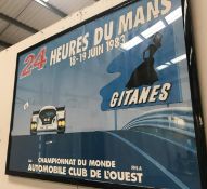 a 24 Heures du Mans framed and glazed poster.
