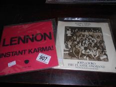 John and Yoko 'Happy Xmas' and John Lennon 'Instant Karma!'.