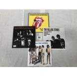 Rolling Stones EP and 3 7" singles all sealed and mint condition.