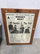 A framed and glazed 'Mersey Beat' 1962 copy featuring The Beatles.