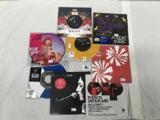 8 7" singles including Mumford and Sons coloured vinyl, picture discs etc.