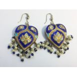 A pair of reversible basse taille enamel pendant earrings, fashioned as hearts.