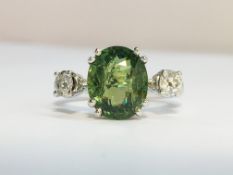 A Contemporary Demantoid Garnet and Diamond Ring in 18ct white gold.