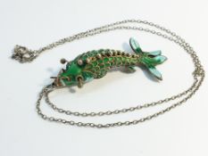 A Chinese cloisonné enamelled carp fish pendant, with fully articulated body on silver chain.