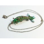 A Chinese cloisonné enamelled carp fish pendant, with fully articulated body on silver chain.