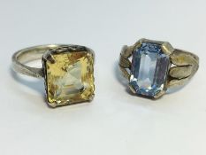 An Octagonal Citrine ring set in silver. Heart shaped gallery detail. Ring size O.