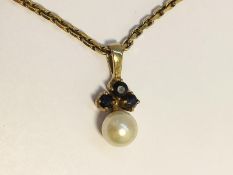 A Sapphire and Pearl Pendant set in 9ct gold on 9ct chain. Pearl measures 6.5mm diameter.