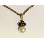 A Sapphire and Pearl Pendant set in 9ct gold on 9ct chain. Pearl measures 6.5mm diameter.