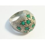 A 1970s emerald bombe ring in 18ct white gold. Set with 15 emeralds in star settings, ETCW 1.12 ct.