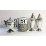 A Sterling Silver Cruet Set hallmarked Sheffield 1955/ 1956 comprising a salt,