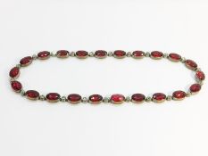 An Antique Red and White Oval Paste Gem Collar, measuring 16" in length. With trigger clasp.