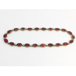 An Antique Red and White Oval Paste Gem Collar, measuring 16" in length. With trigger clasp.