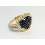 A Sapphire and Diamond Heart Shaped Cluster Ring set in 18ct yellow gold.