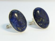 A pair of oval Lapis Lazuli Cufflinks, measuring approximately 28mm long.